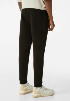 BERSHKA PLUSH SEAMS - Jogginghose - Black -Bershka Verkaufsgeschäft 234d25c80b304882a64275ae312bcc5c