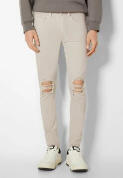 BERSHKA RIPPED - Jeans Slim Fit - Beige